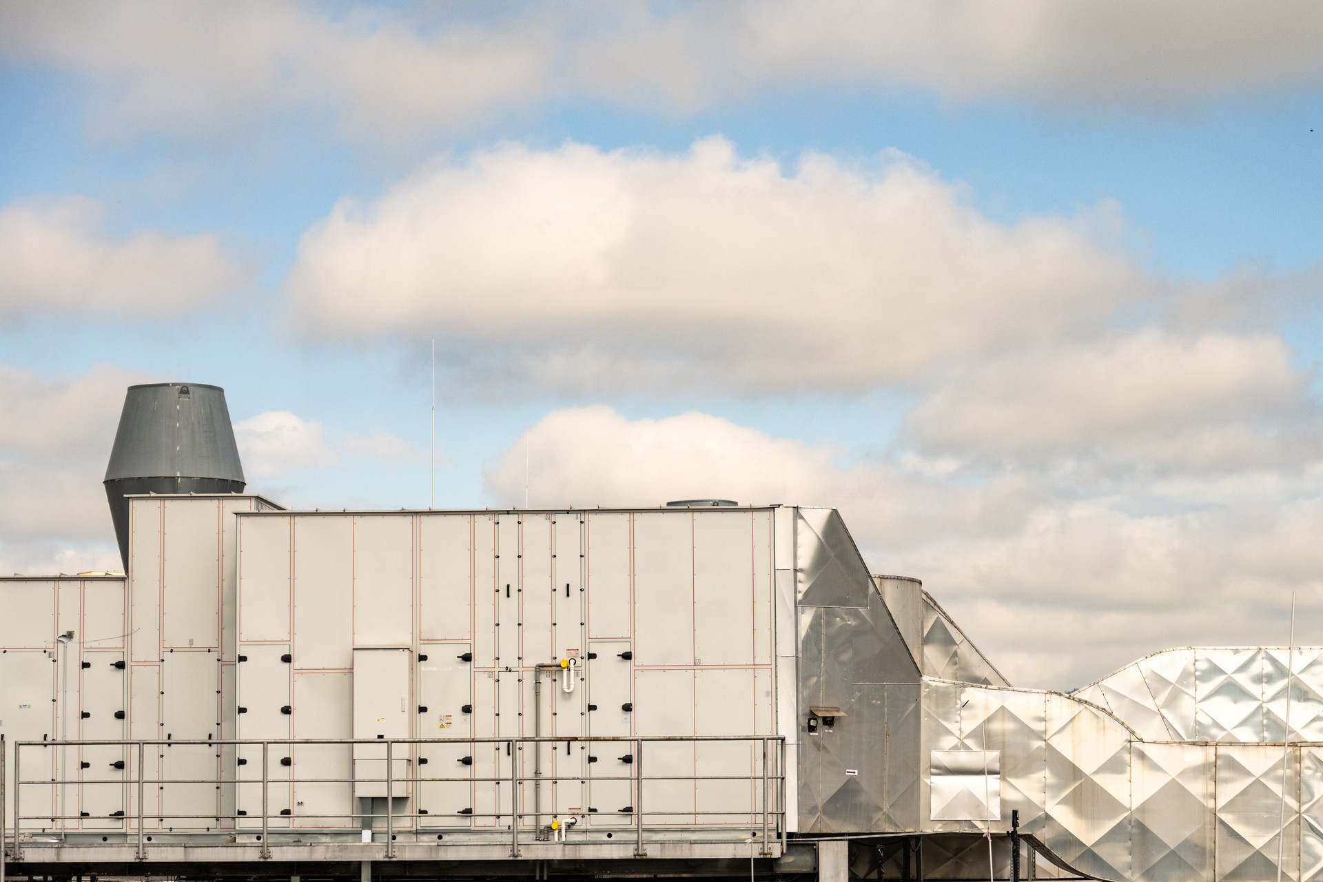 Commercial Rooftop HVAC System Against Cloudy Sky